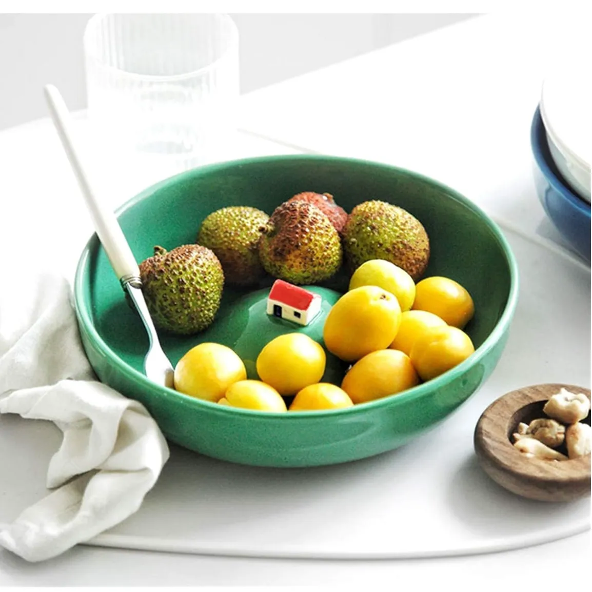 La maison indondee bowl filled with fruit.